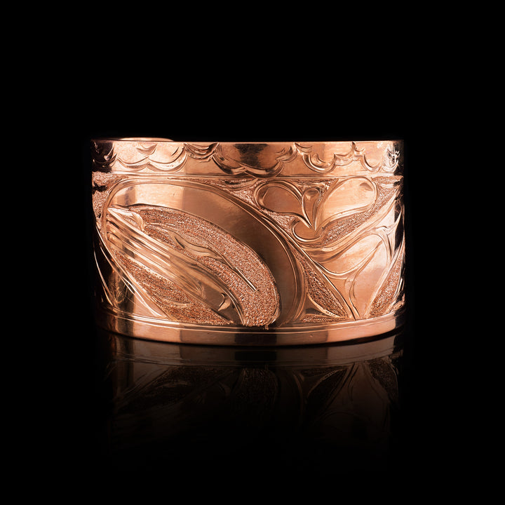 The legend of the Orca and the Sun carved into this half inch wide Copper cuff bracelet.