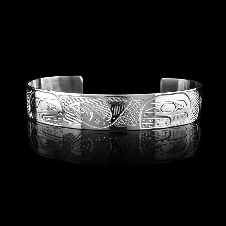This 1/2" sterling silver double Orca & Salmon bracelet cuff is hand carved with the legend of the Salmon and The Orca. 
