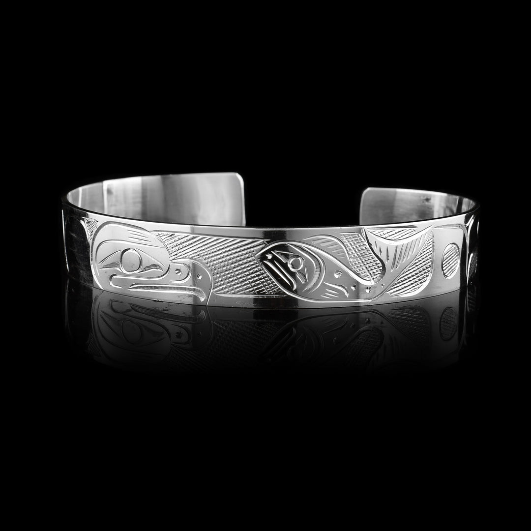1/2" Sterling Silver Large Salmon and Eagle Cuff Bracelet, slightly larger the Eagle takes up one half while the salmon takes up the other half meeting in the middle of the cuff.