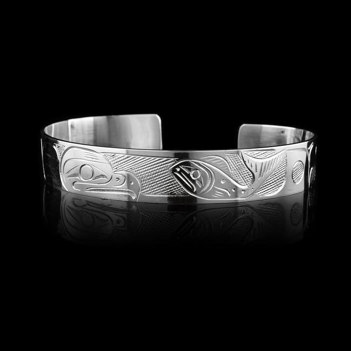 1/2" Sterling Silver Large Salmon and Eagle Cuff Bracelet, slightly larger the Eagle takes up one half while the salmon takes up the other half meeting in the middle of the cuff.