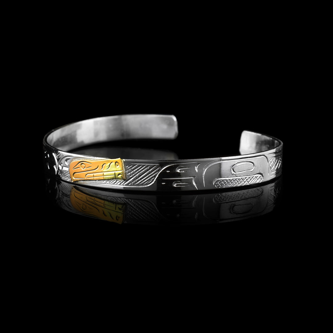 1/4" Sterling Silver carved with indigenous patters and 10k Gold carved with the legend of the Bear.