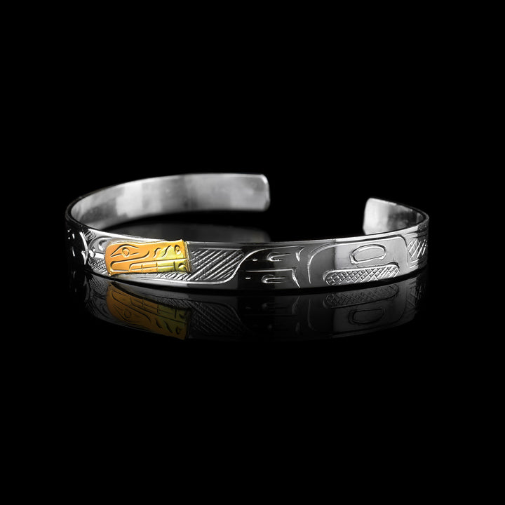 1/4" Sterling Silver carved with indigenous patters and 10k Gold carved with the legend of the Bear.