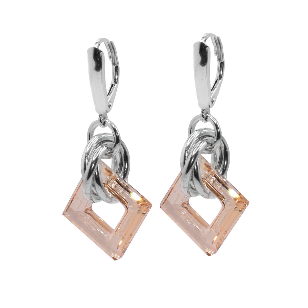 These small dangle hoop earrings have square shaped hoop hangs made from champagne Swarovski crystals. The crystals have three sterling silver hoops linked through them and those hoops are linked through a smaller one attached to the hooks.