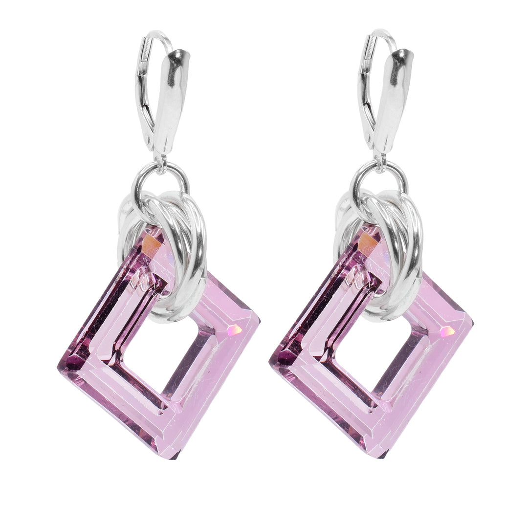 These dangle hoop earrings have square shaped hoop hangs made from antique pink Swarovski crystals. The crystals have three sterling silver hoops linked through them and those hoops are linked through a smaller one attached to the hooks.