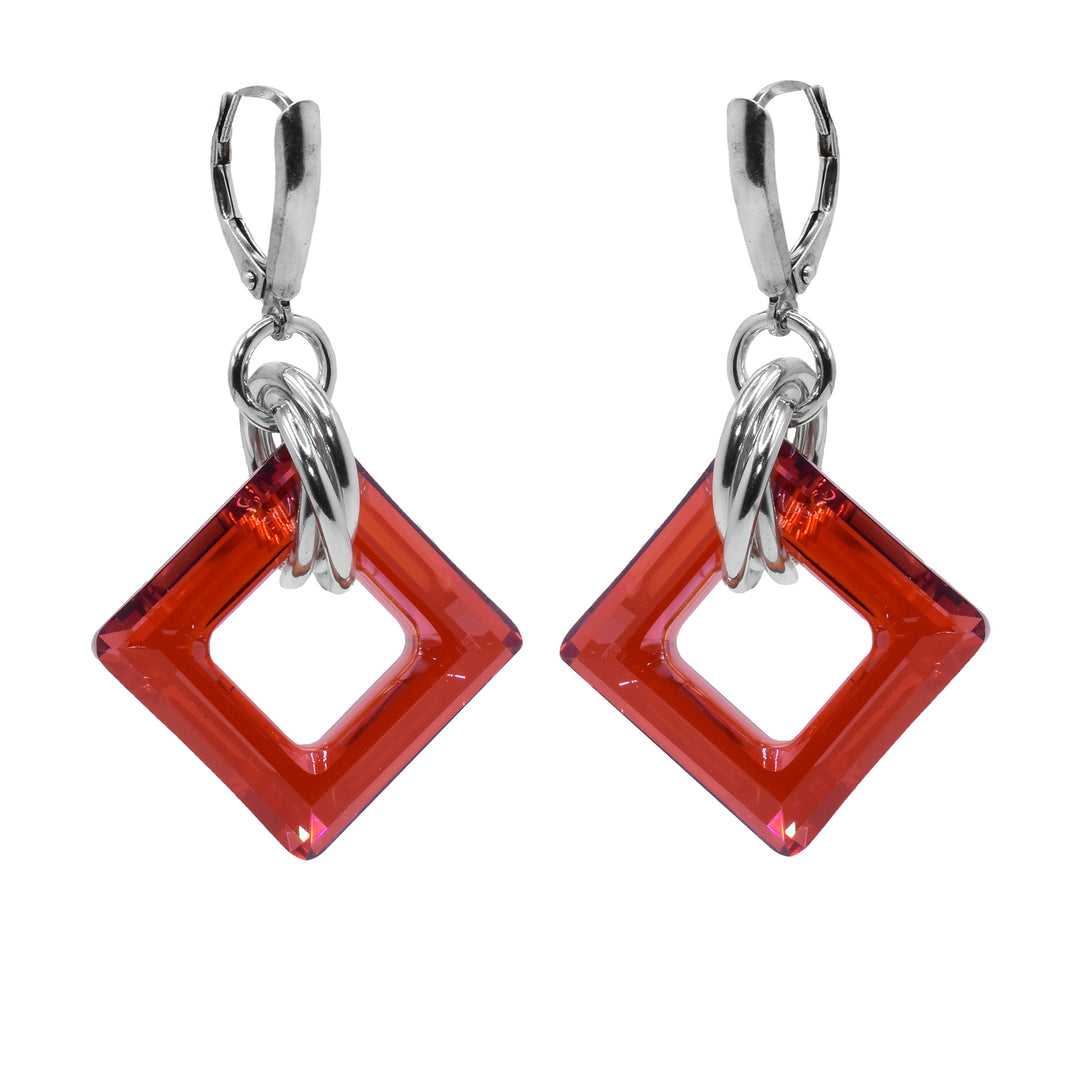 These dangle hoop earrings have square shaped hoop hangs made from persimmon Swarovski crystals. The crystals have three sterling silver hoops linked through them and those hoops are linked through a smaller one attached to the hooks.