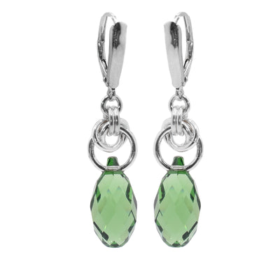 These Swarovski Drop Earrings have oval shaped peridot Swarovski crystals that dangle from a sterling silver hoop. There are smaller hoops linked through the larger one that connect to the hooks.