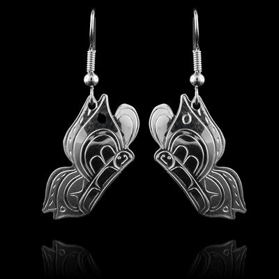 These Butterfly earrings have sterling silver hangs shaped like the Butterfly. It is depicted in the side profile and are attached to the hooks by the tops of the wings. There are details carved into the wings and the body of the butterfly.