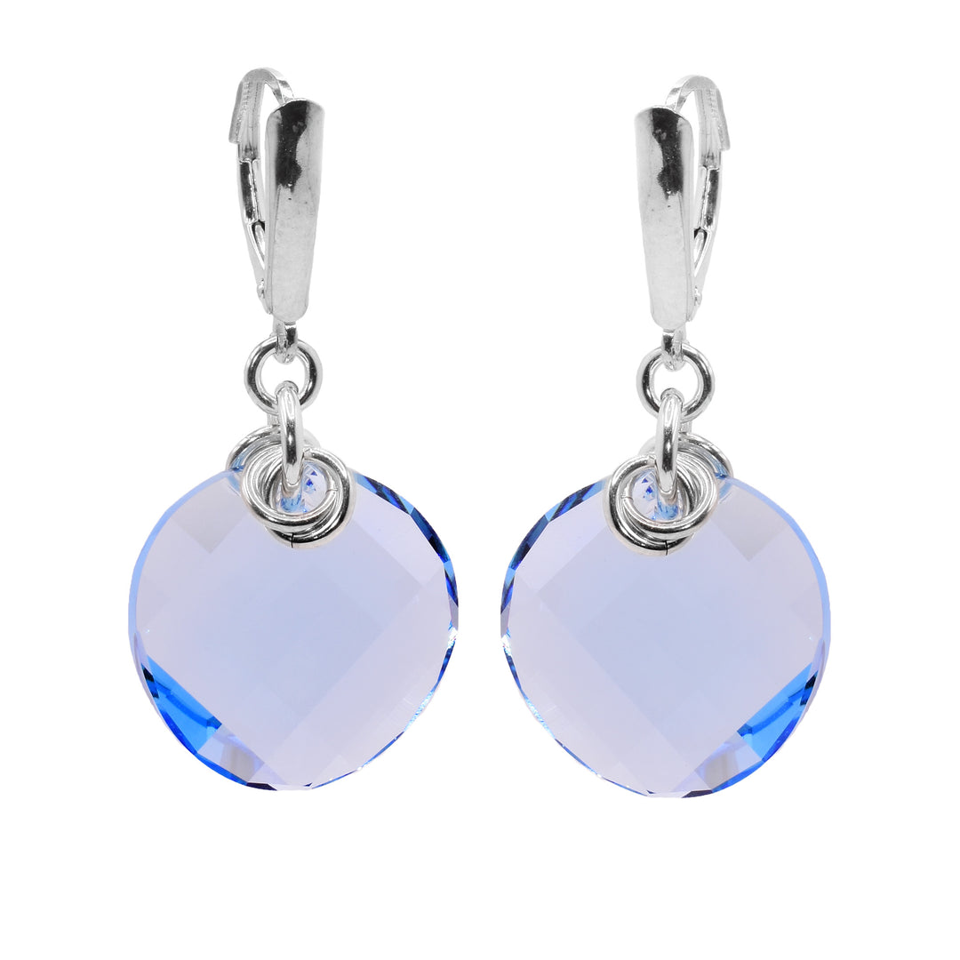 These circle crystal earrings have circle shaped hangs made from blue aqua Swarovski crystals. The crystals are connected to the hooks with small, sterling silver hoops with multiple hoops linked through them.