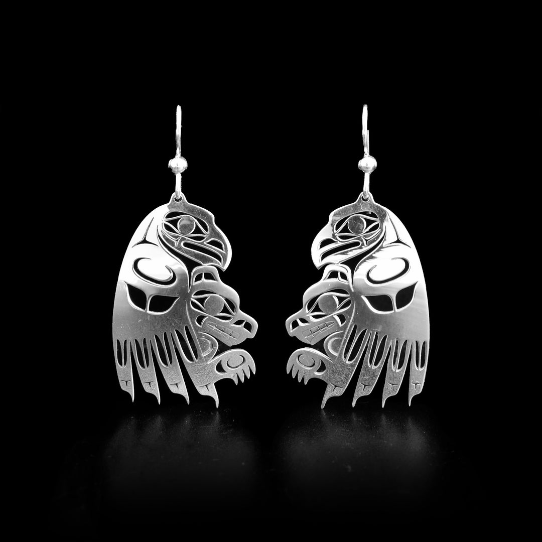 These sterling silver earring have the shape of the Eagle with the Wolf under the Eagle. 