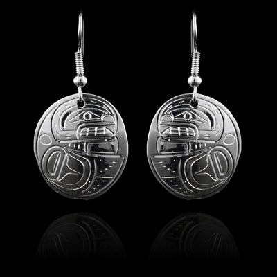 These sterling silver circle earrings have circle shaped hangs that are attached directly to the hooks. The Orca is depicted in the side view with its head at the top of the hangs and its fin wrapped below it.