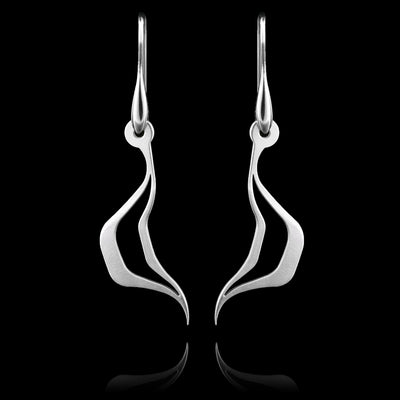 These silver dangling earrings drop down and split into a zig-zag teardrop shape with a cutout in the middle. There is a horizontal, u-shaped teardrop shape. The hangs depict Haida Gwaii characters.