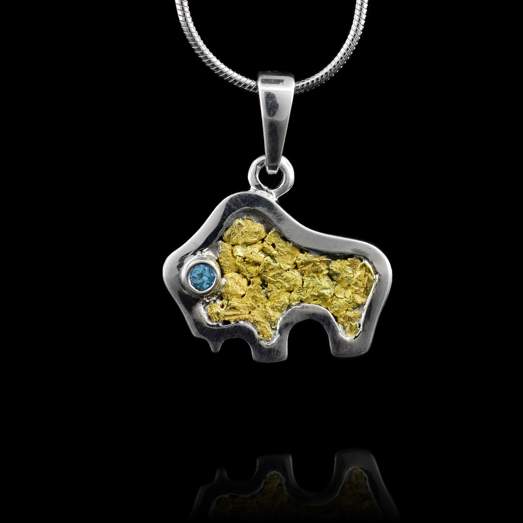 22k Gold Nugget Bison with a blue topaz eye