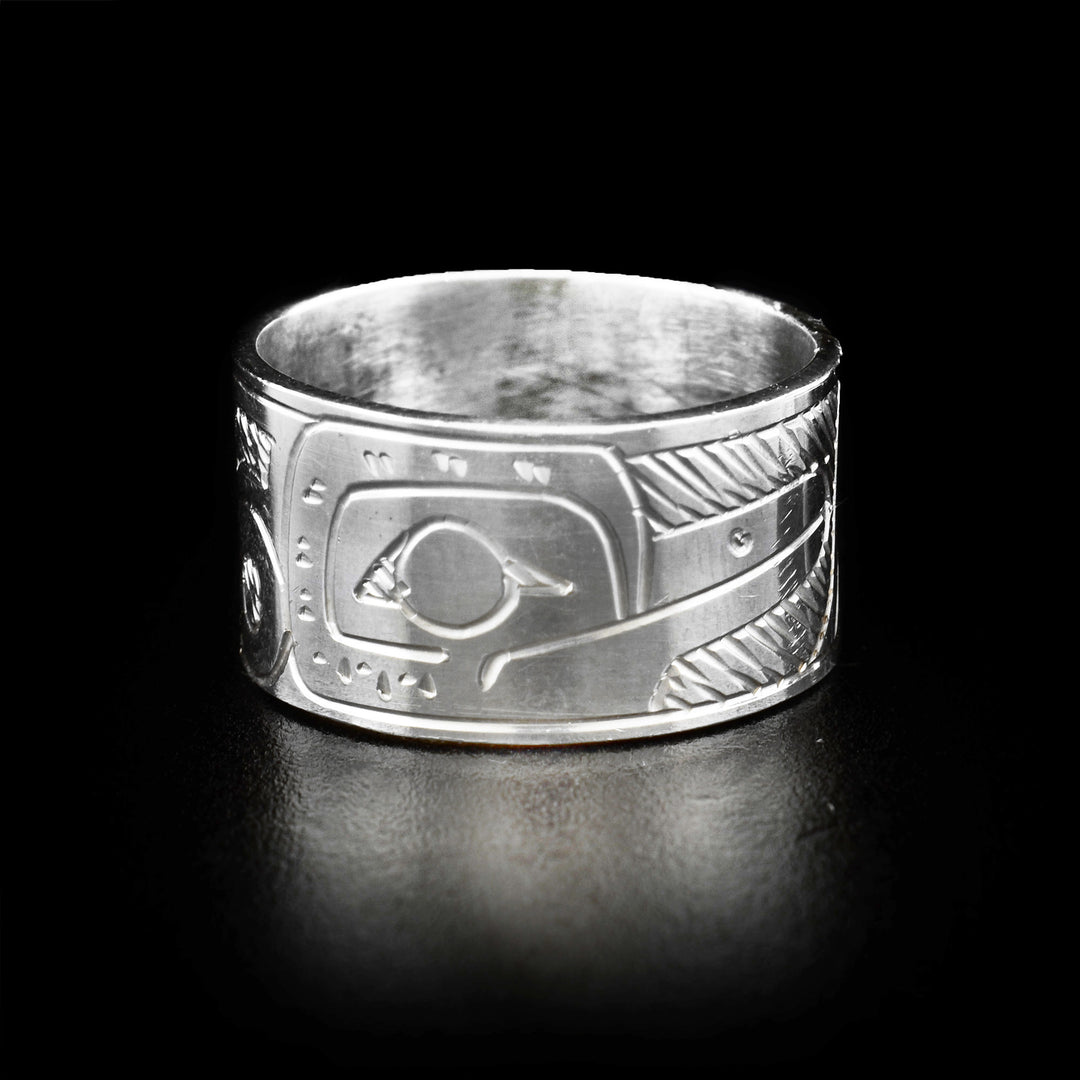 The Hummingbird ring is made out of sterling silver. The Hummingbird's face is carved on one side of the band. The rest of the band has the Hummingbird body carved on it.