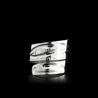 This wrap ring was handcarved on sterling silver. It depicts the Wolf.
