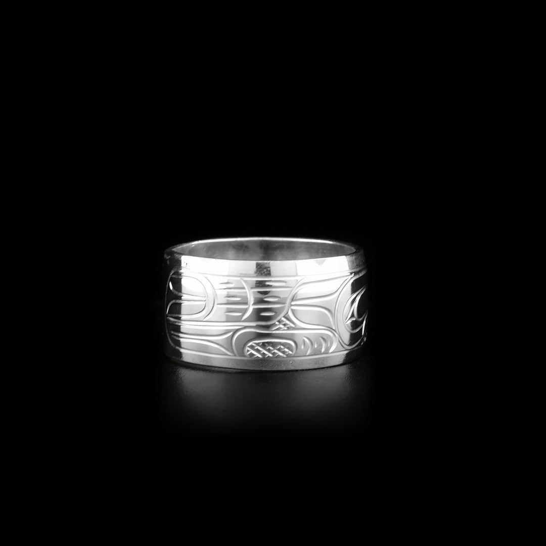 This heavy gauge Eagle ring is made from sterling silver. The band is wide and there is a depiction of the Eagle carved into the surface of it.