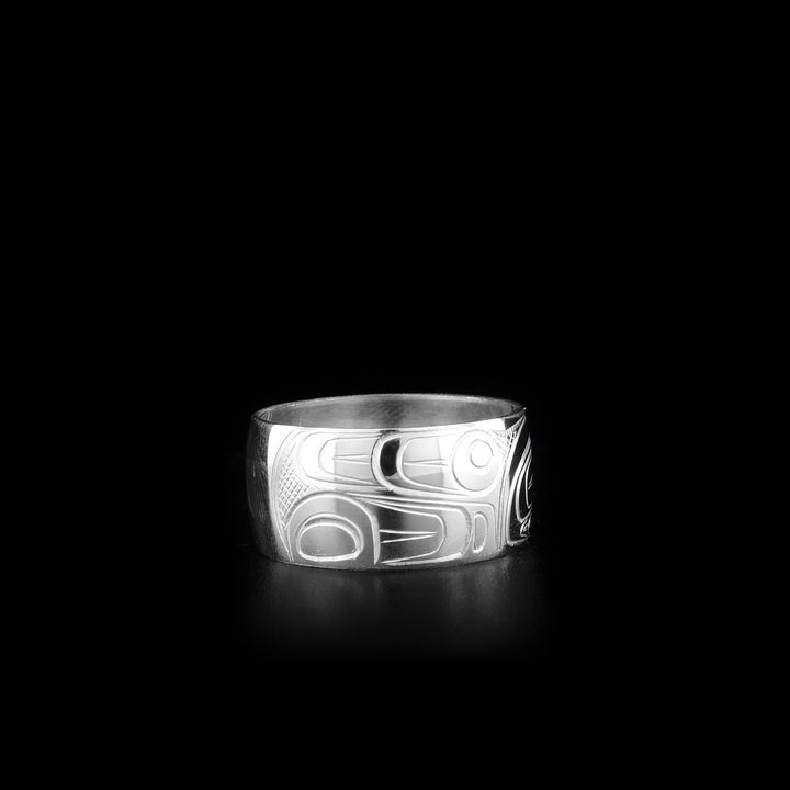 This heavy gauge Orca ring is made from sterling silver. The band is wide and there is a depiction of the Orca carved into the surface of it.