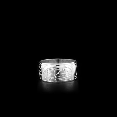 This heavy gauge Orca ring is made from sterling silver. The band is wide and there is a depiction of the Orca carved into the surface of it.