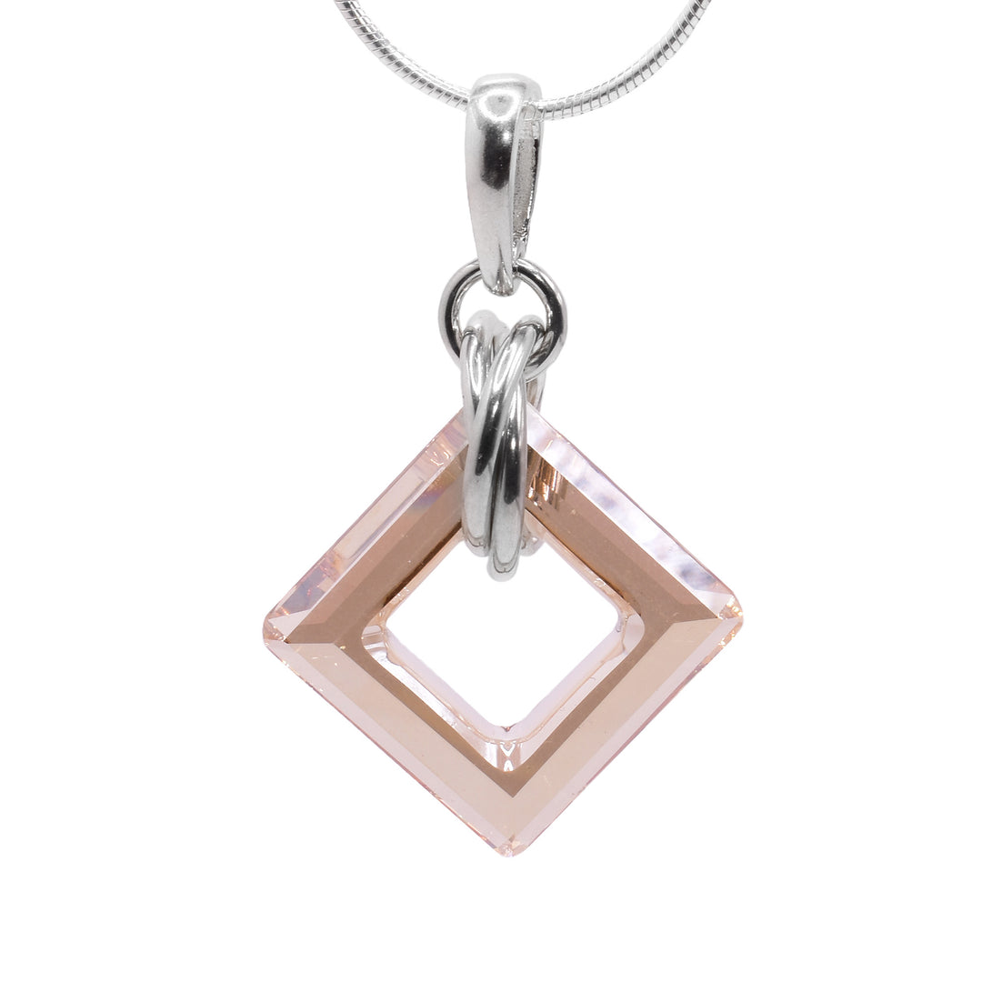 This champagne Swarovski crystal drop pendant has a square, cutout Swarovski crystal with multiple sterling silver hoops forming a chain. The crystal dangles from a small link and there are three, larger hoops linked through the crystal.