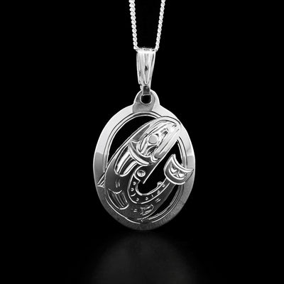 This salmon pendant is oval in shape and depicts a full-bodied salmon facing the left when worn. The background has been cut out for depth.