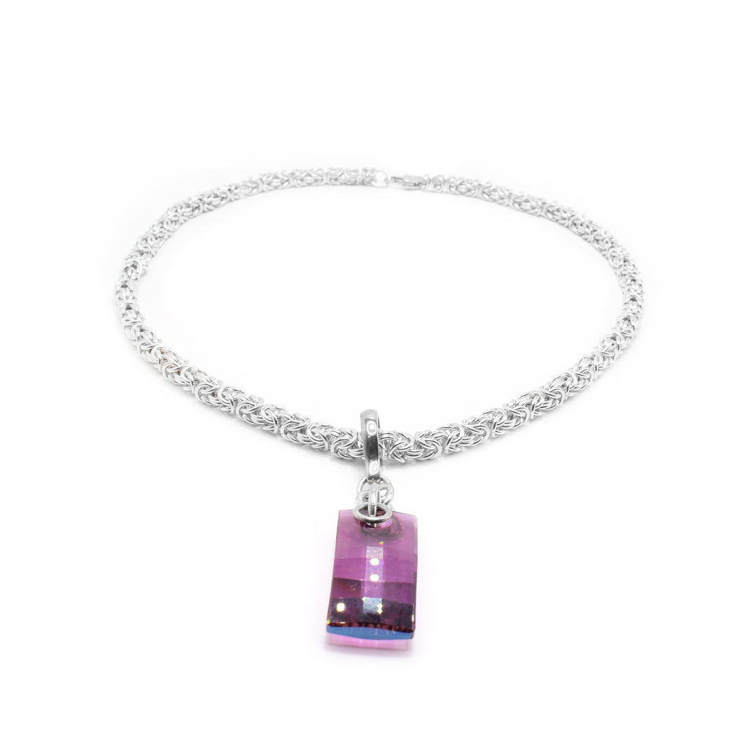 This crystal pendant has a sterling silver jump ring and chain with a rectangular urban amethyst Swarovski crystal attached to it.
