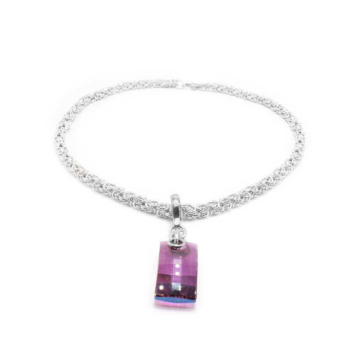 This crystal pendant has a sterling silver jump ring and chain with a rectangular urban amethyst Swarovski crystal attached to it.