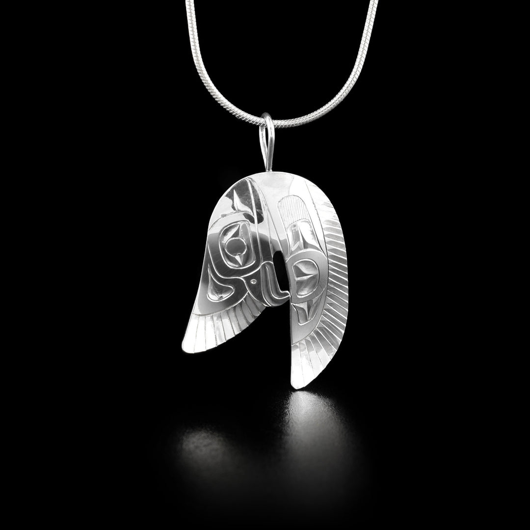 This eagle necklace has an eagles head facing downward with its two wings spread out at its sides.