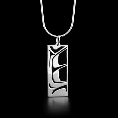 This sterling silver pendant has a rectangular shape and depicts the Raven.