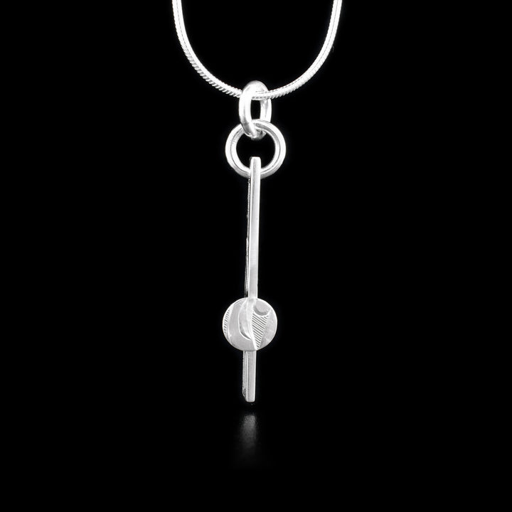 This Sterling Silver Rectangular Raven Pendant with Round Accent is hand carved by artist, Hollie Bartlett. This silver pendant shows the raven carved in sterling silver with a round accent positioned at its midpoint, giving it a unique profile.

The pendant measures approximately 0.25" wide by 1.75" long.

The chain is not included.



The Raven Legend Represents: CREATIVITY, MICHIEF, MAGIC