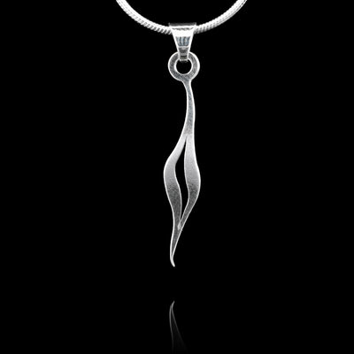 These sterling silver pendants drop down then splits in the middle to form a small teardrop. The piece depicts a Haida Gwaii character.