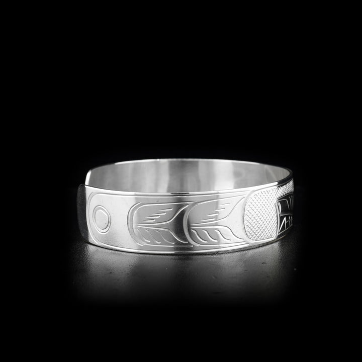 This sterling silver Wolf bracelet has a depiction of the Wolf carved into the surface of the band.