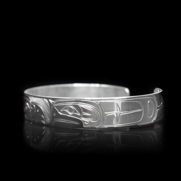 This sterling silver cuff bracelet has a depiction of the Eagle carved into the surface of the band.