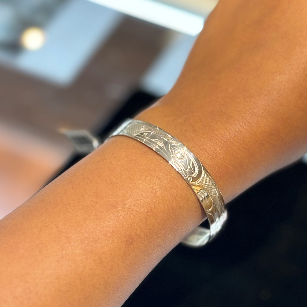 This photo shows the raven bracelet on a female wrist.