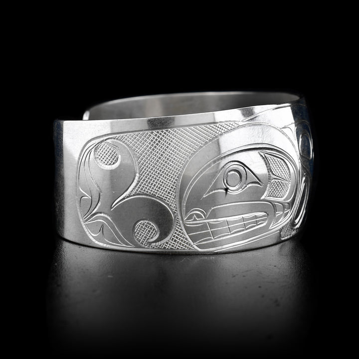 This sterling silver cuff bracelet has a wide band and there is a beautiful depiction of the Orca carved into the surface of the band. 