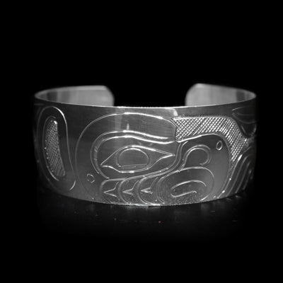 This sterling silver wide cuff bracelet has a full depiction of the Eagle beautifully carved into the surface of the band.