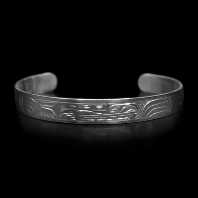 This Bear bracelet has a thin, sterling silver band with a gap in the back. There is a depiction of the Bear carved into the band.