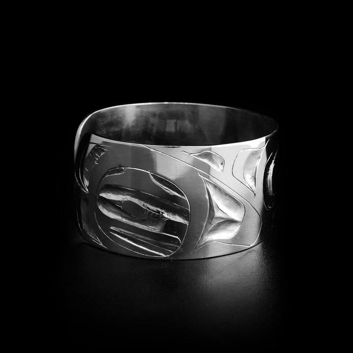 Left angle photo of the bracelet shows the orca's tail on the left side of the bracelet.