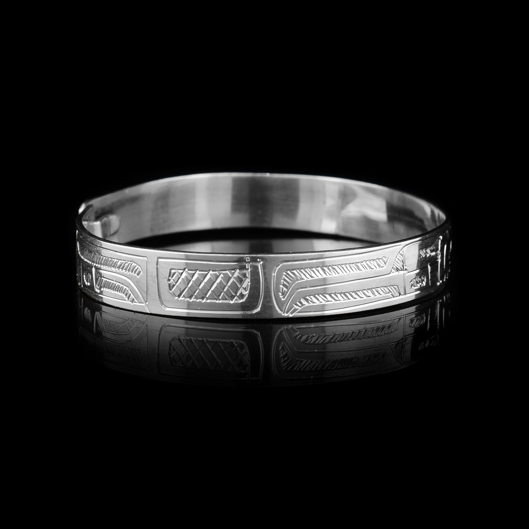 This Bear bracelet has a sing band with a clasp in the back. There is a depiction of the Bear carved into the surface of the band.