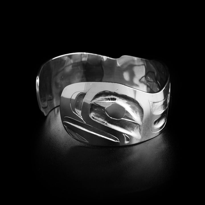Left angle photo of the bracelet shows the head of a smaller eagle facing the left.