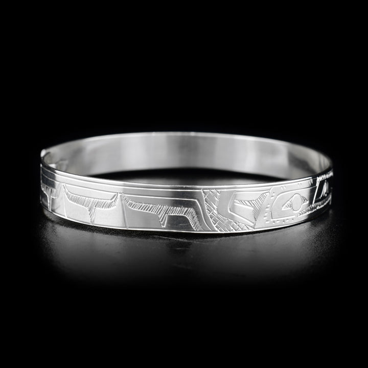 This Hummingbird and Eagle bracelet is made from sterling silver and there are depictions of the Hummingbird and Eagle carved into the band. There is a clasp at the back of it and the Legends are depicted facing each other at the top of the band.