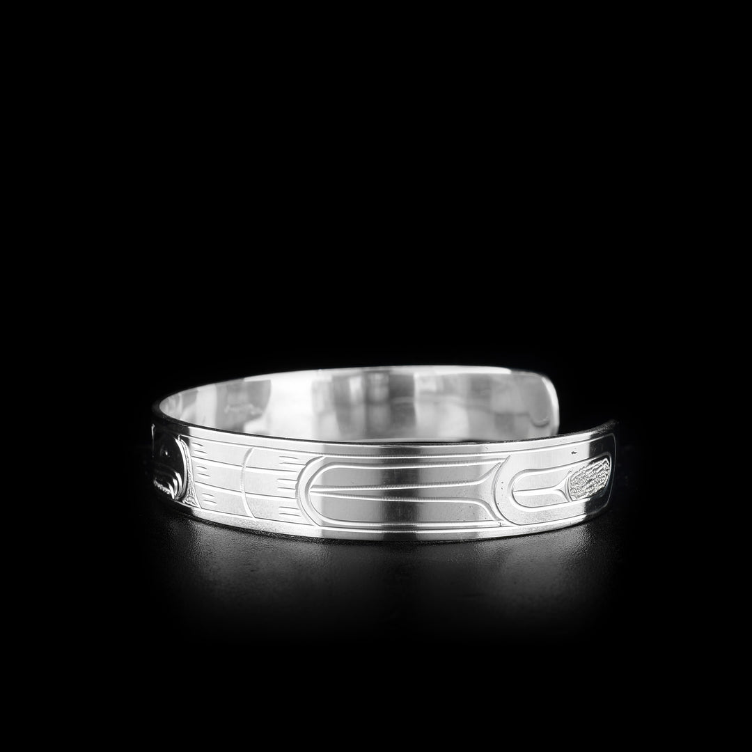 This Eagle bracelet is made from sterling silver and is a cuff bracelet. There is a depiction of the Eagle carved into the surface of the band.