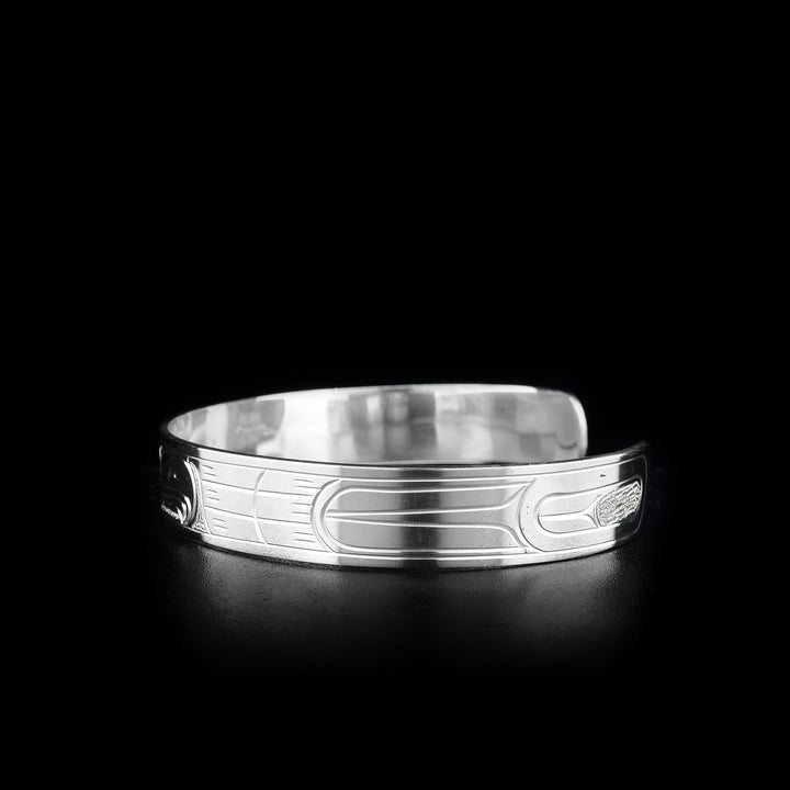This Eagle bracelet is made from sterling silver and is a cuff bracelet. There is a depiction of the Eagle carved into the surface of the band.