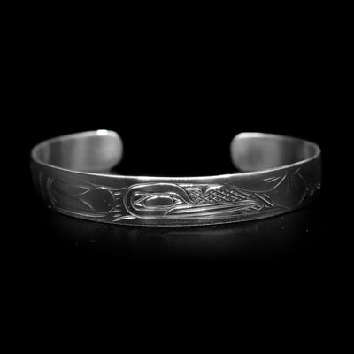 This dainty bracelet has a thin, sterling silver band with a gap in the back. There is a depiction of the Hummingbird that has been beautifully carved into the surface of the band.