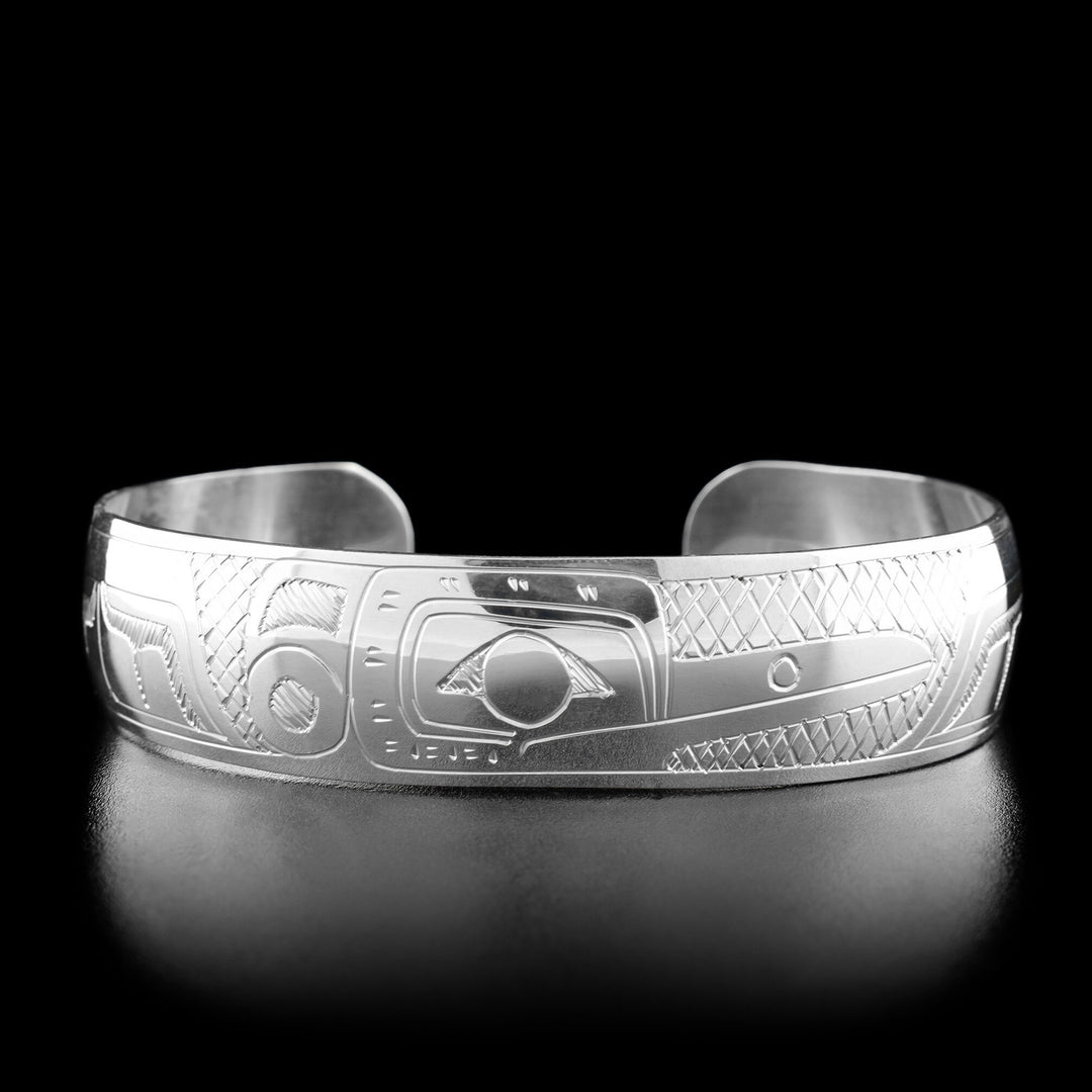 This hummingbird bracelet has the profile of a hummingbird's head facing the right in the center with a small feather on its head.