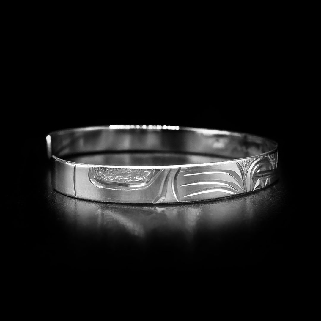Left angle photo of the bracelet depicts the wolf's other front paw.
