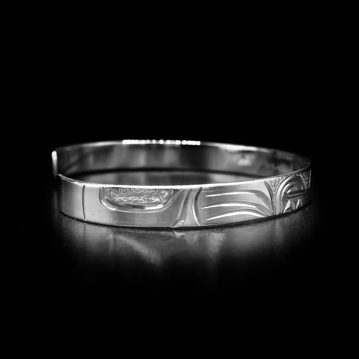 Left angle photo of the bracelet depicts the wolf's other front paw.