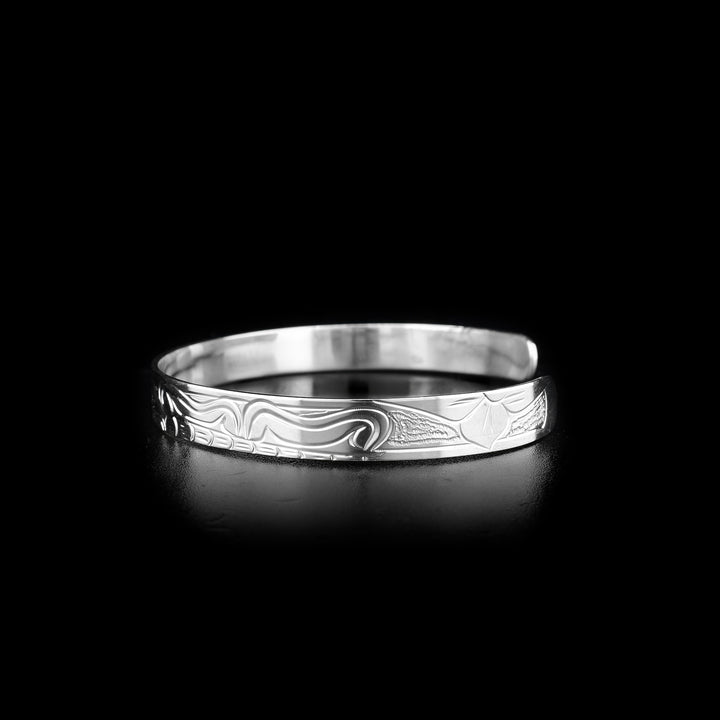 This Hummingbird bracelet has a thin band and is a cuff bracelet. There are depictions of the Hummingbird and a butterfly carved into the surface of the band.