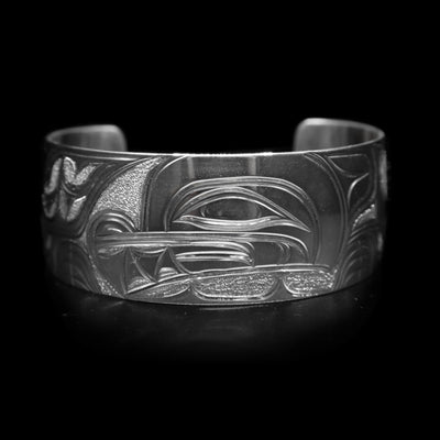 This sterling silver wide cuff bracelet has a full depiction of the Wolf beautifully carved into the surface of the band.