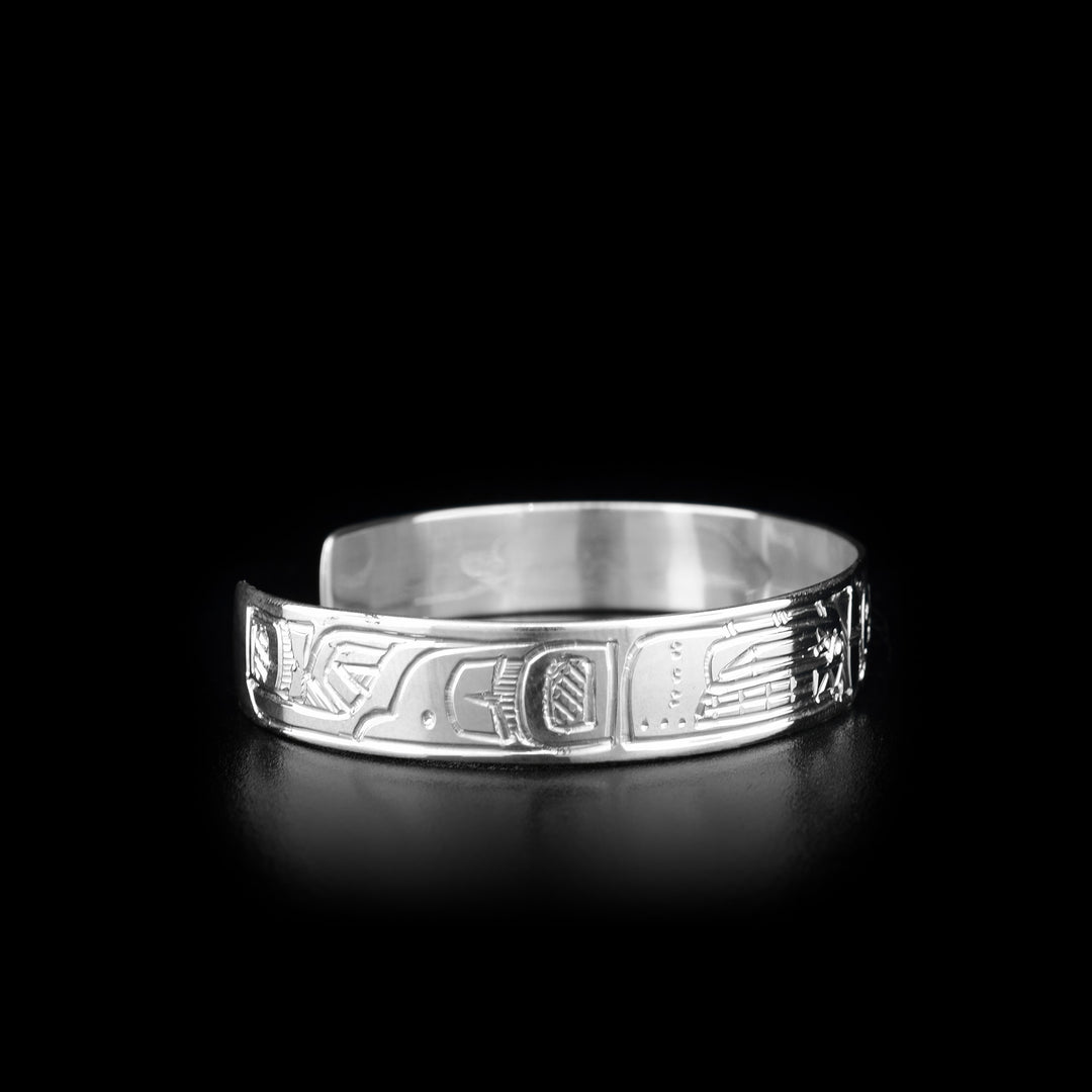 This Orca and Sun bracelet is made from sterling silver and there are two depictions of the Orca and a depiction of the Sun carved into the band of the cuff bracelet.