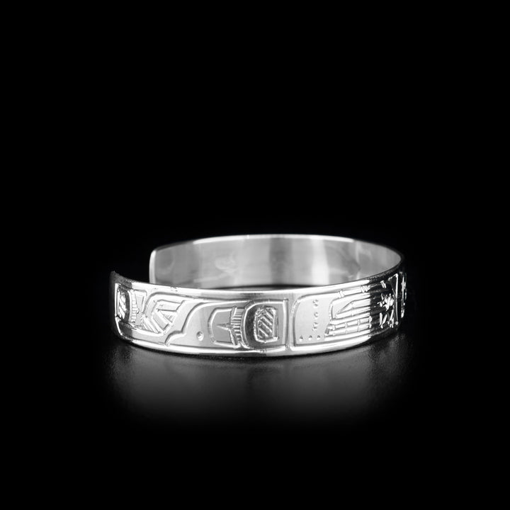 This Orca and Sun bracelet is made from sterling silver and there are two depictions of the Orca and a depiction of the Sun carved into the band of the cuff bracelet.