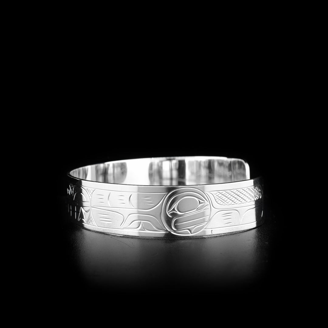 The Wolf and Moon bracelet is made from sterling silver. There are depictions of the Wolf and the Moon carved into the surface of the cuff.